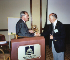 Allen Selhime receives Pioneer Lecturer Award from David Hall